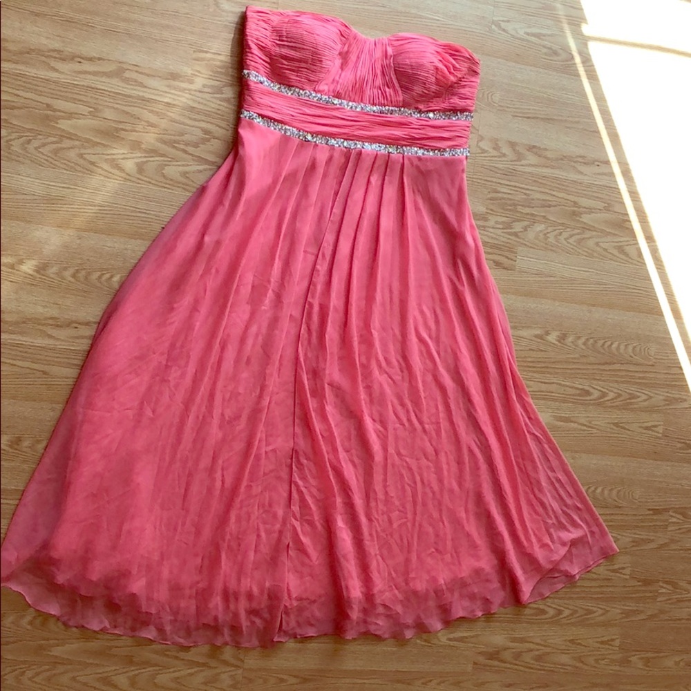 A beautiful salmon strapless event dress